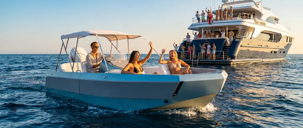 Blue WaterCar Signature with a canopy alongside a yacht.