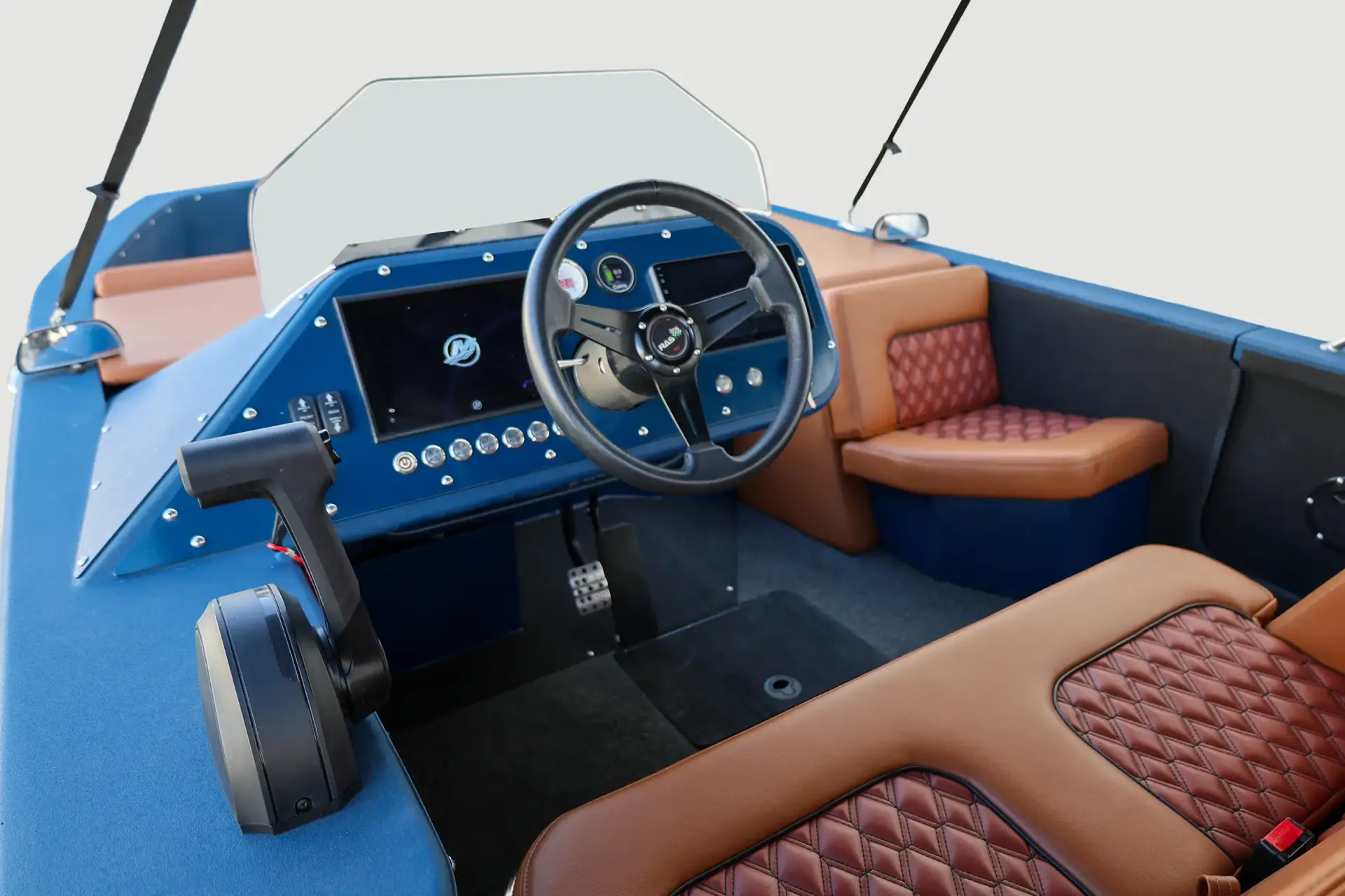Blue and tan WaterCar helm November 2025, showing the steering wheel, displays, throttle and seating.