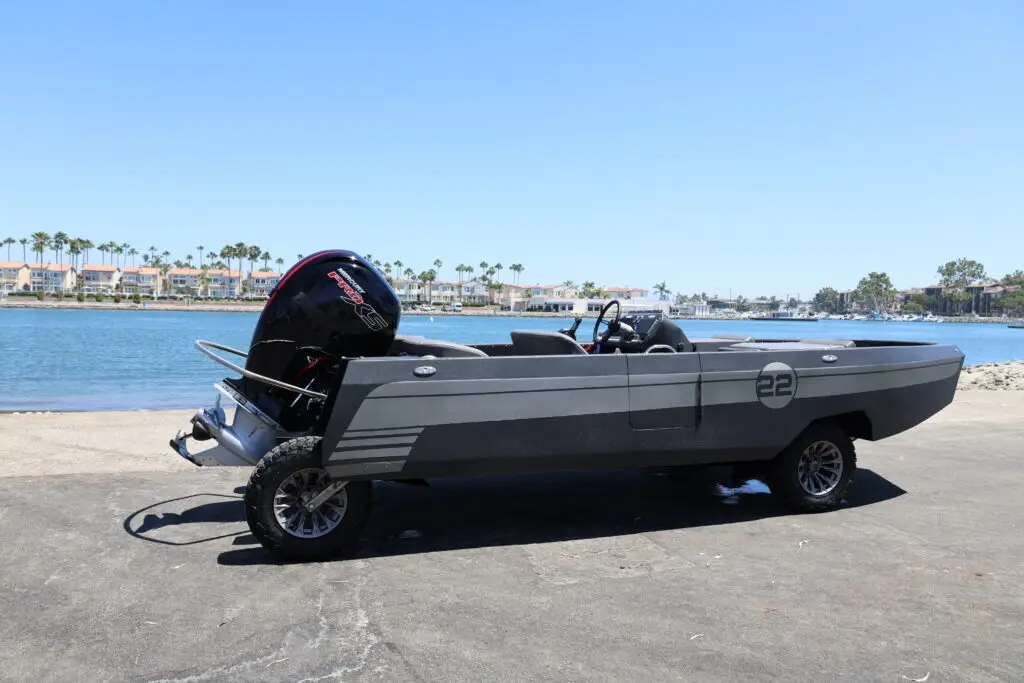 Joey's number 22 WaterCar beside the water, rear three-quarter view