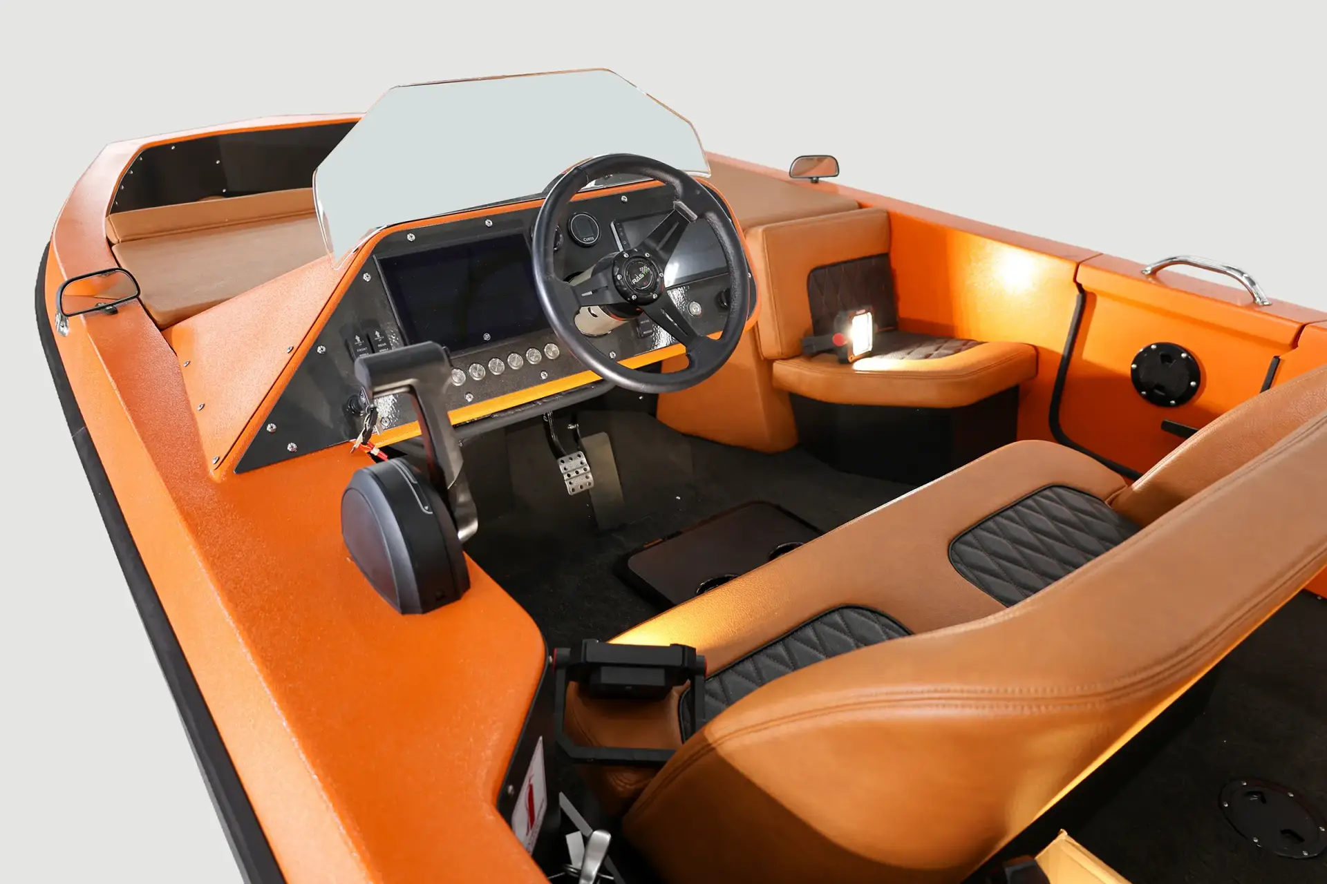 Orange WaterCar helm January 2026, showing the steering wheel, displays, throttle and seating.