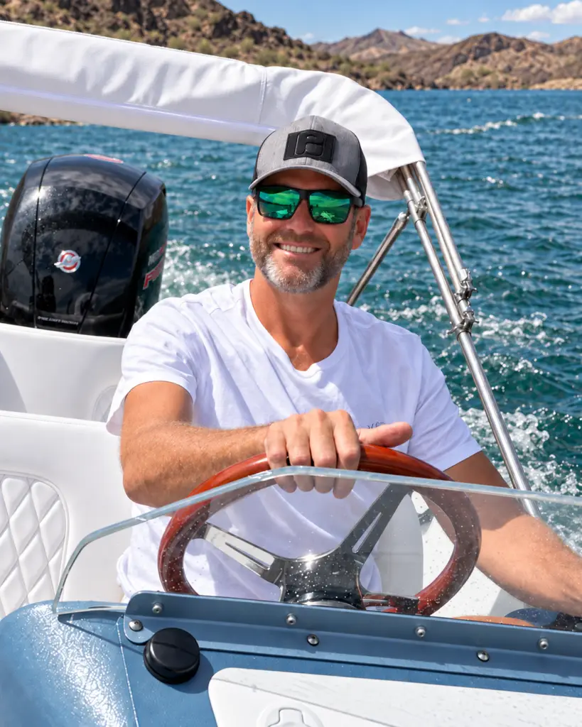 Michael March smiling at the helm of a WaterCar.