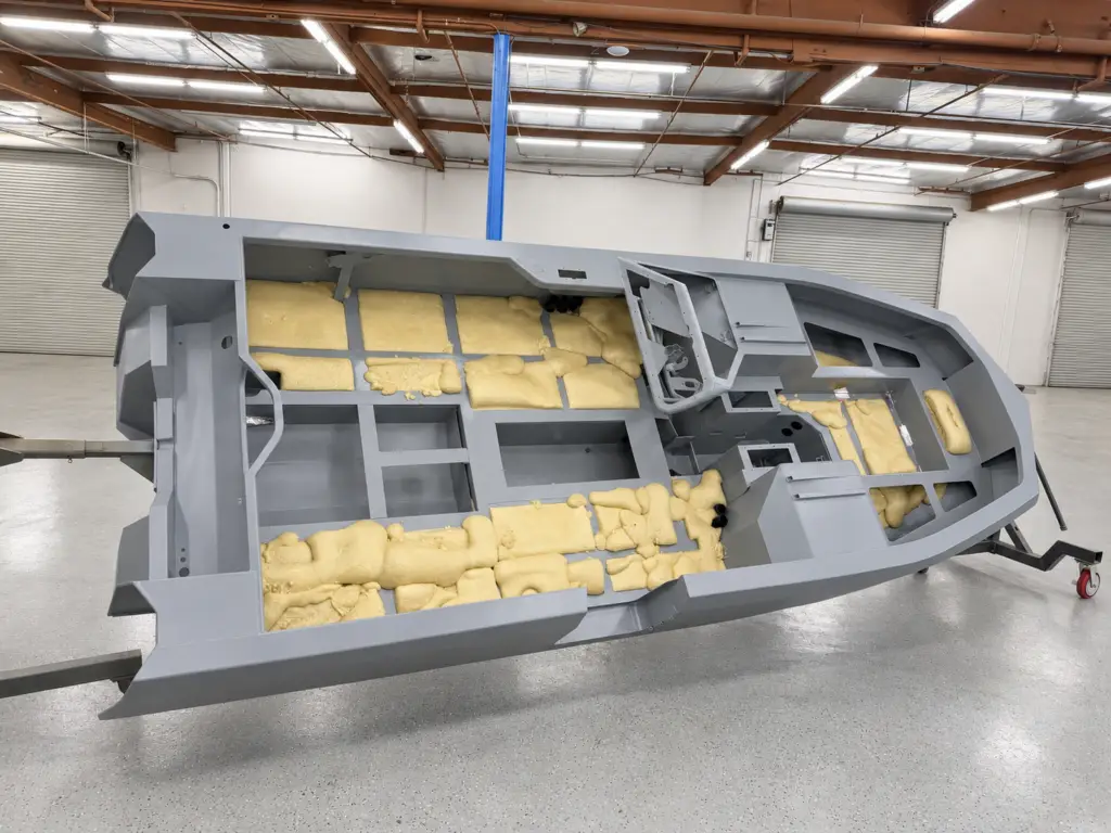 Closed-cell flotation foam inside the coated WaterCar hull structure. Retouched presentation photograph.