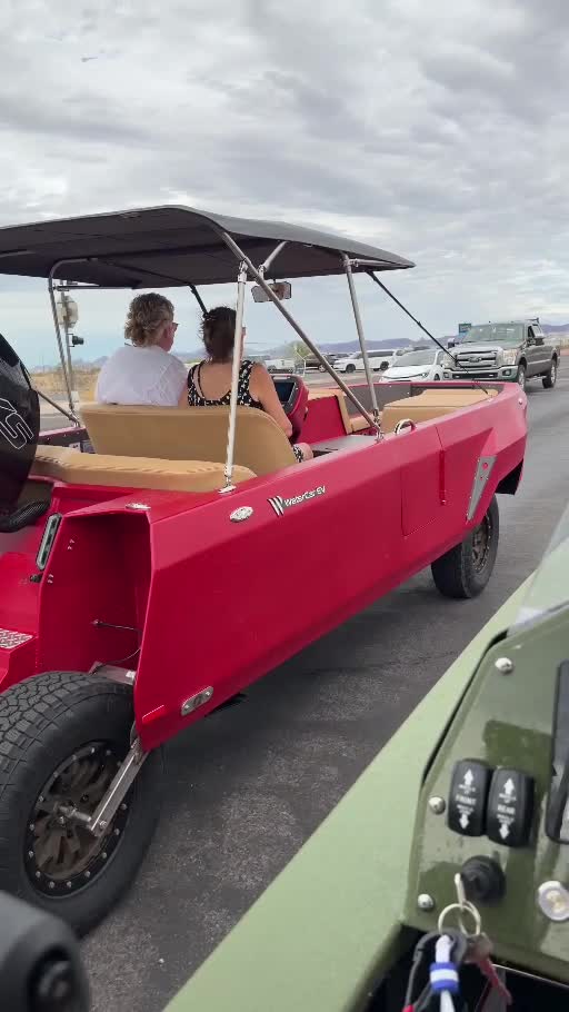 A drive in Dave March’s green WaterCar alongside a red WaterCar