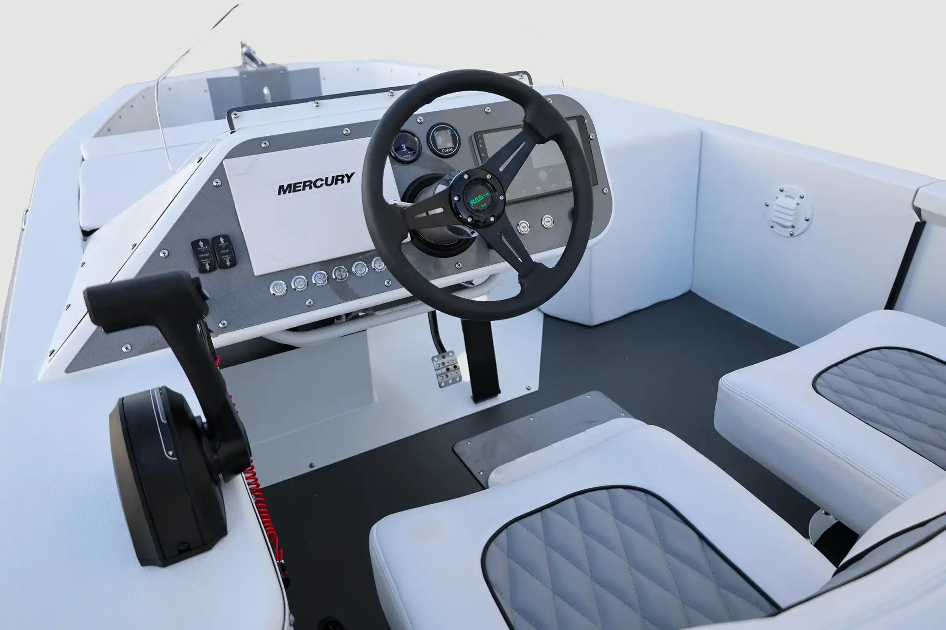 White and gray WaterCar helm November 2025, showing the steering wheel, displays, throttle and seating.