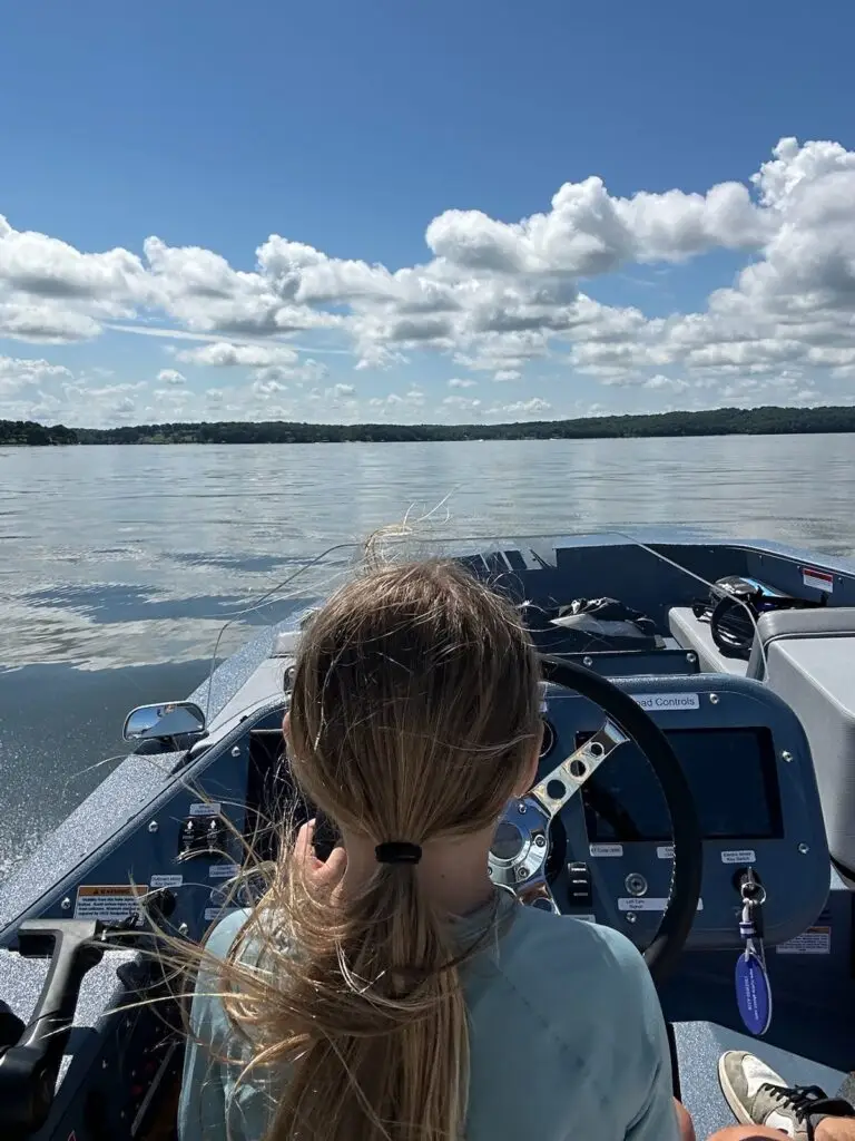 A day on the lake aboard Cam’s WaterCar in Oklahoma, with golf clubs in the bow