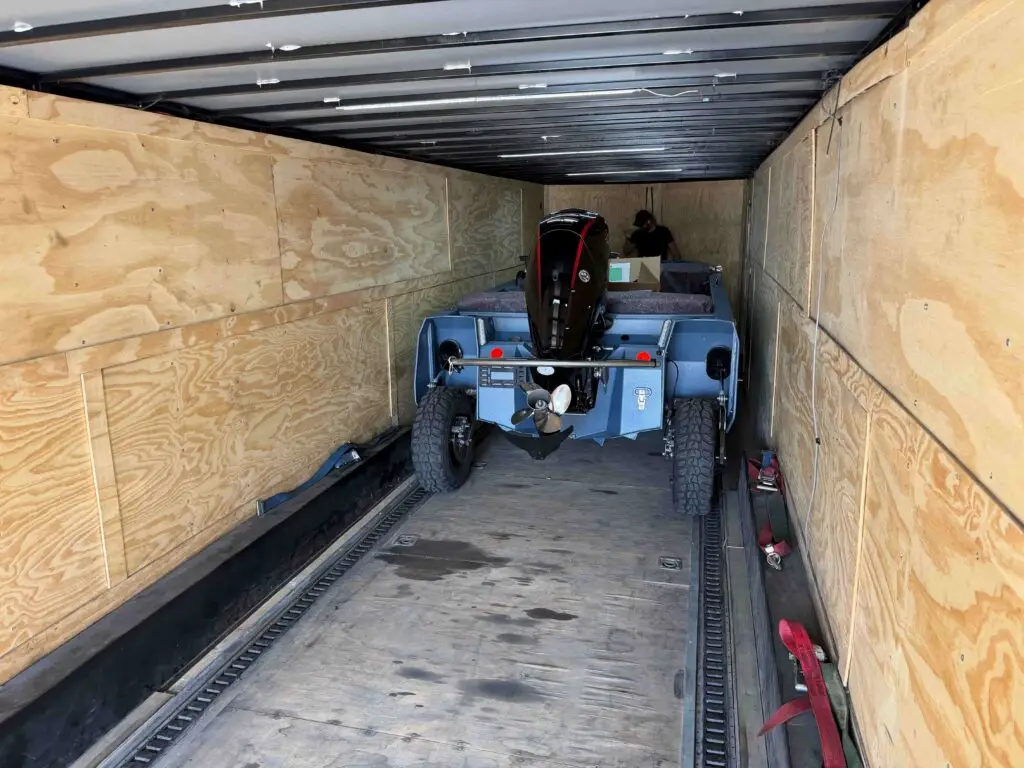 Rear view of Cam’s WaterCar inside the transport trailer