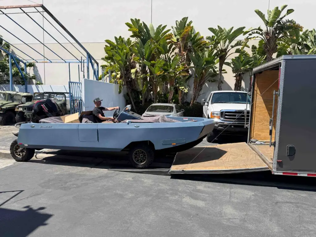 Cam’s WaterCar beside the enclosed transport trailer