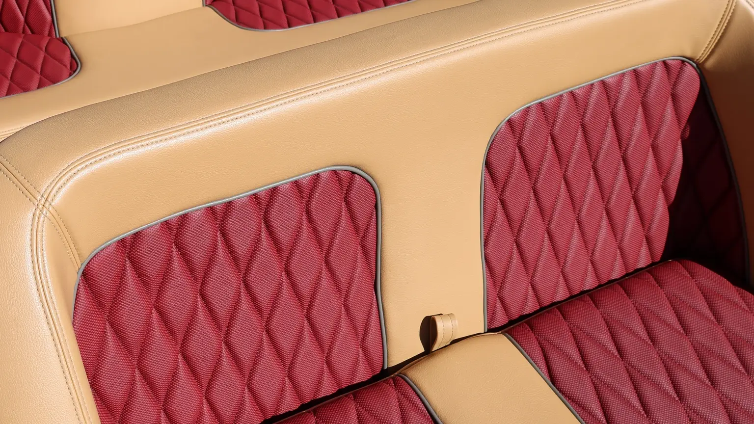 Red quilted upholstery, tan seat trim and double stitching in a WaterCar Signature.
