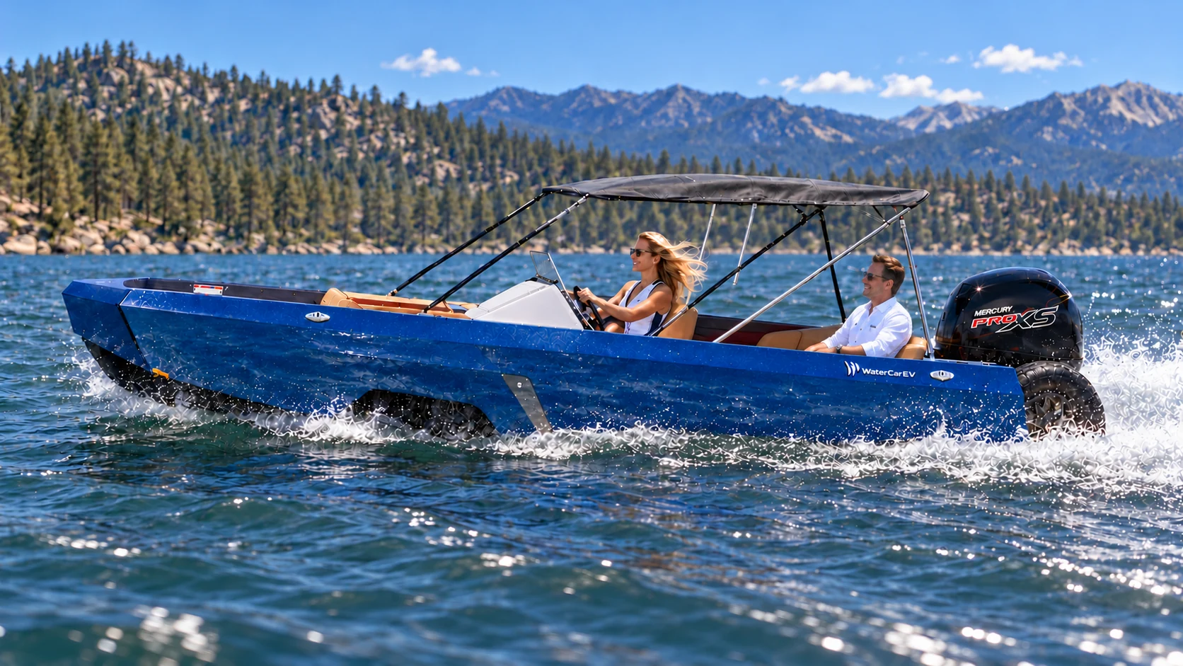 A couple cruises a blue WaterCar Signature across a mountain lake.